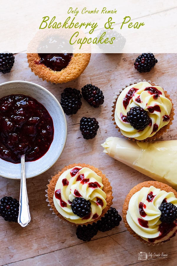 blackberry and pear cupcakes with piping bag and bowl of jam.
