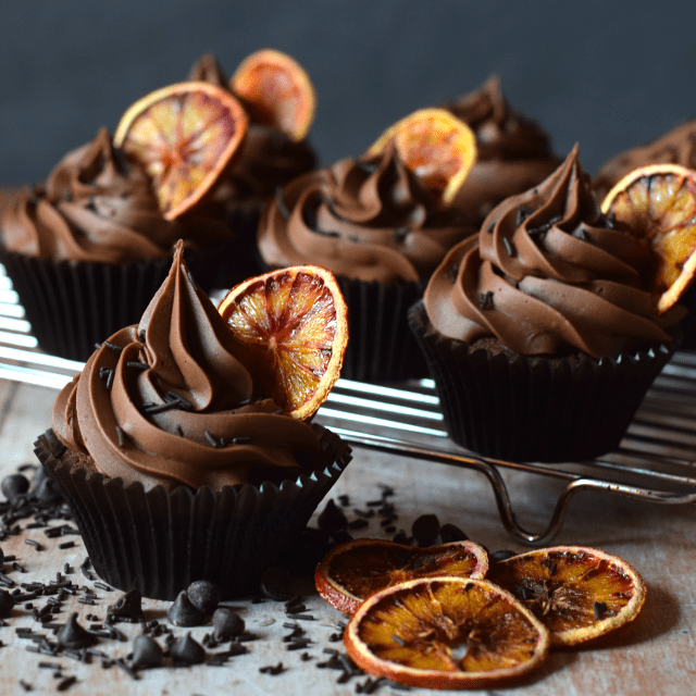 Double chocolate orange cupcakes on a cooling rack