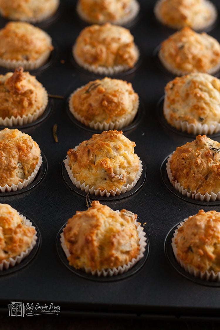 cheesy walnut and rosemary muffins in muffin tin 