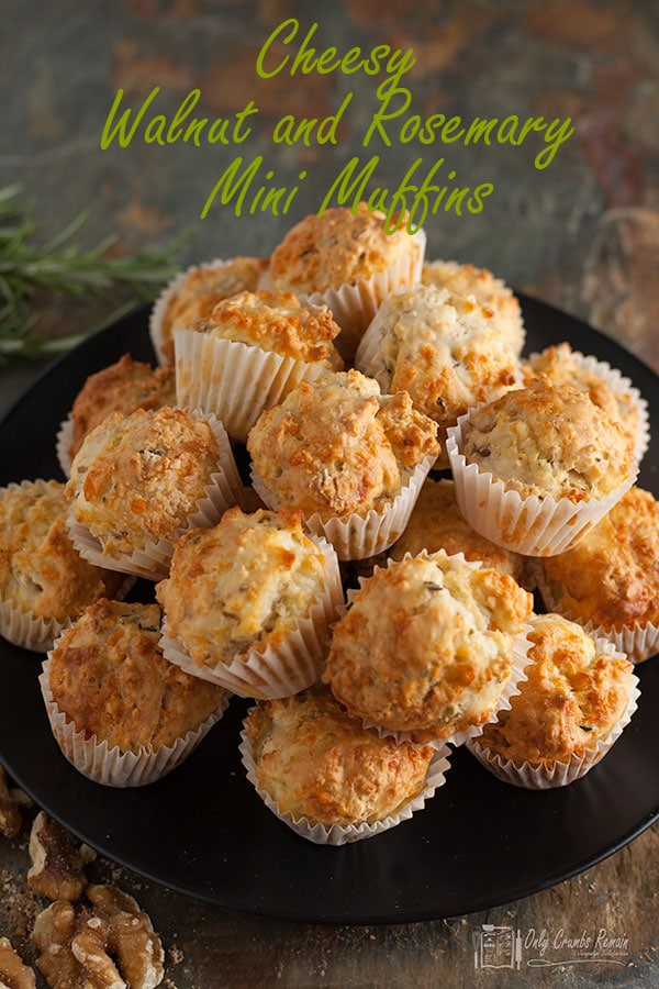 pile of cheesy walnut and rosemary mini muffins on a plate